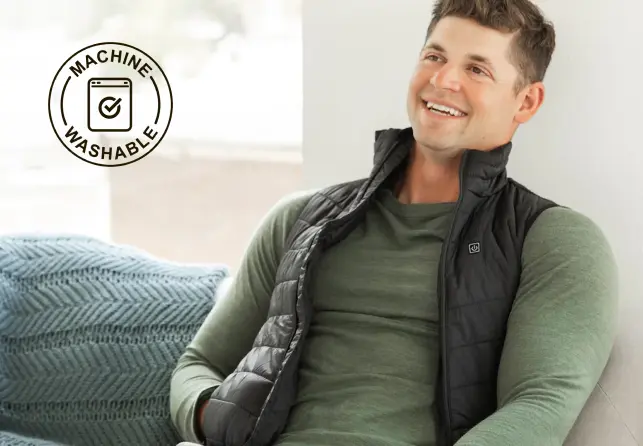 Man relaxing at home in the heated vest