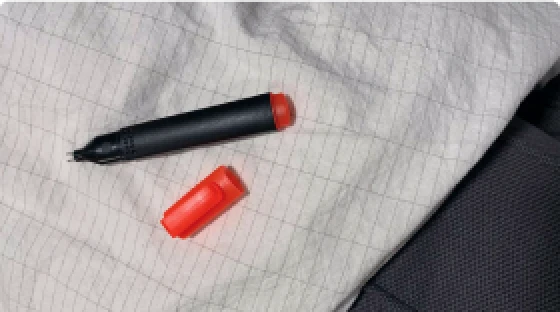 The Velin tester pen resting on a grounding sheet